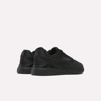 A pair of black Reebok Nano X5 Training Shoes with textured soles and subtle branding, shown side by side on a plain white background from a rear-side angle—ideal training shoes for comfort.
