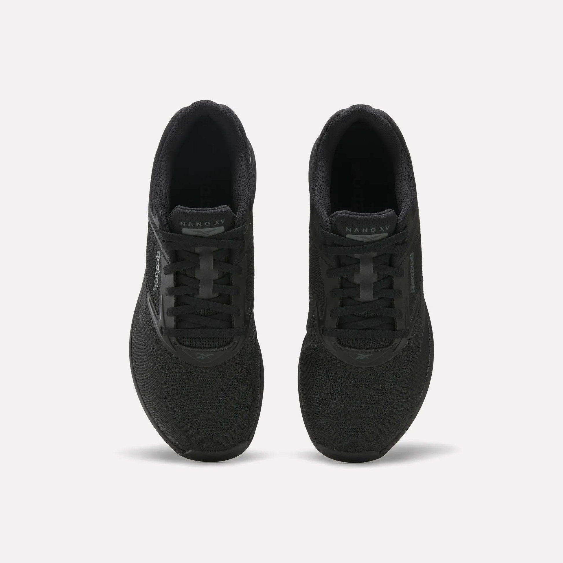 A pair of black Reebok Nano X5 Training Shoes with mesh uppers and lace-up closures are shown from above, side by side on a plain light background.