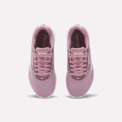 A pair of Reebok Nano X5 Women's Training Shoes in pink, viewed from above with visible laces, mesh upper, dual-density midsole, and white soles on a plain white background—ideal for stylish support during training.
