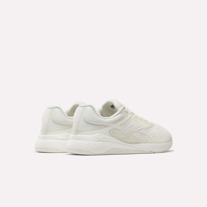 A pair of Reebok Nano X5 Women's Training Shoes in off-white, featuring textured uppers and thick soles, displayed at an angle against a plain white background.