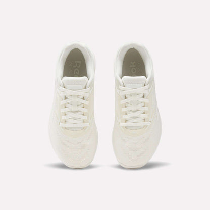 The Reebok Nano X5 Women's Training Shoes, shown from above on a plain white background, highlight their white color, laces, mesh texture, and soles.