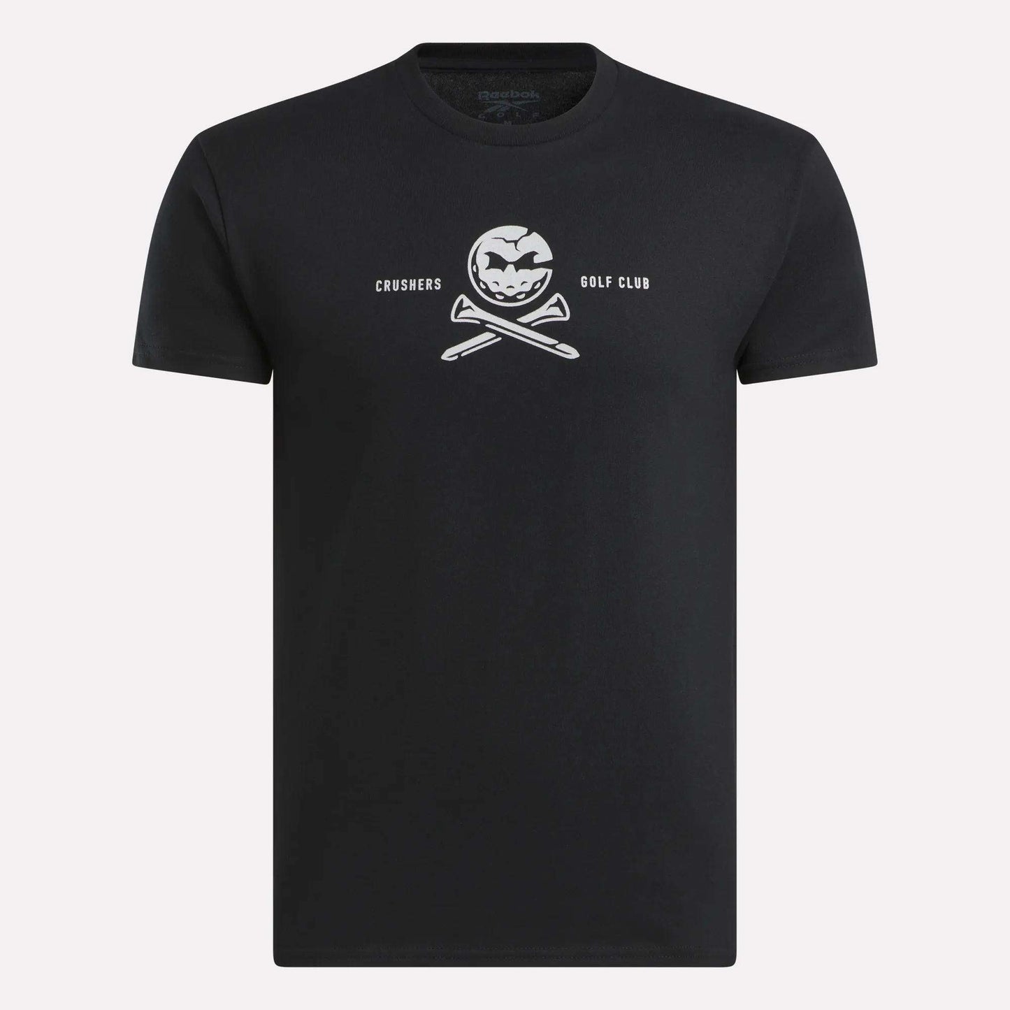 The Men’s Crushers Tee by Reebok features a bold white skull-like logo with crossed golf clubs and “CRUSHERS GOLF CLUB” text centered on the chest, inspired by Bryson DeChambeau.