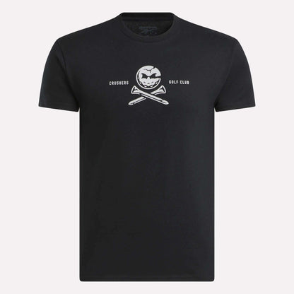 The Men’s Crushers Tee by Reebok features a bold white skull-like logo with crossed golf clubs and “CRUSHERS GOLF CLUB” text centered on the chest, inspired by Bryson DeChambeau.