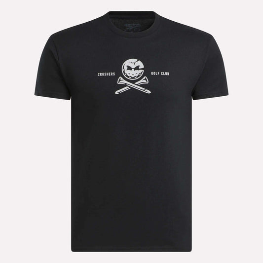 The Men’s Crushers Tee by Reebok features a bold white skull-like logo with crossed golf clubs and “CRUSHERS GOLF CLUB” text centered on the chest, inspired by Bryson DeChambeau.