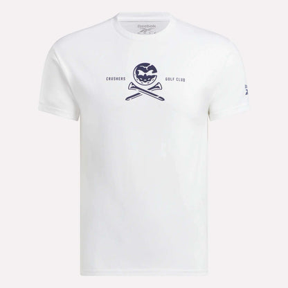 The Men's Crushers Tee by Reebok is a white shirt featuring a navy pumpkin graphic above crossed golf clubs and the text "CRUSHERS GOLF CLUB," inspired by Bryson DeChambeau's passion for the Crushers.