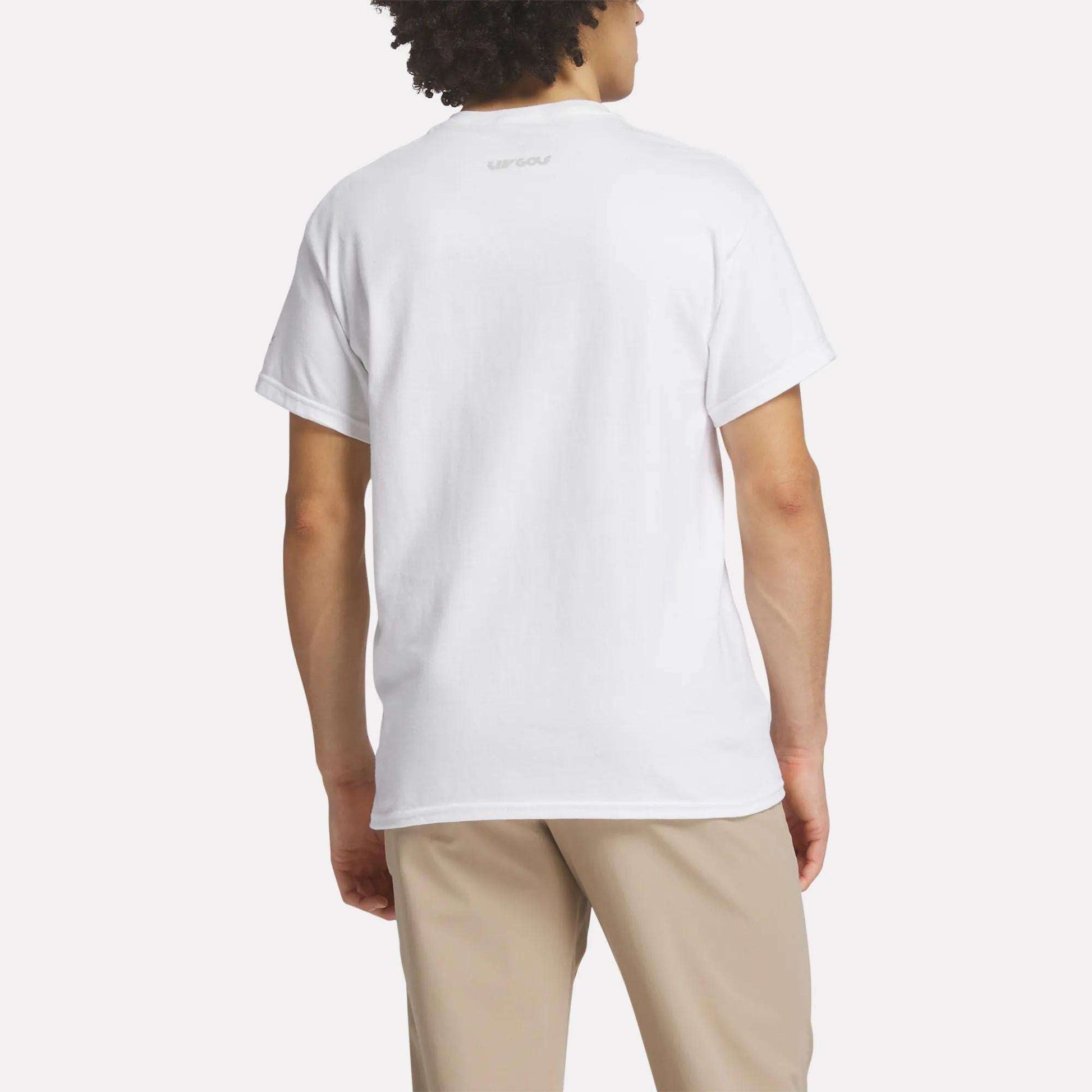 A person is shown from the back, wearing a Men's Crushers Icon Tee by Reebok in plain white and beige pants, standing against a light background.