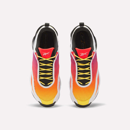 Top view of Reebok x Brain Child DMX Series 3000 Shoes with a yellow-to-orange-pink gradient, black laces, white midsoles, red tongues with a white logo, and responsive cushioning for all-day comfort.