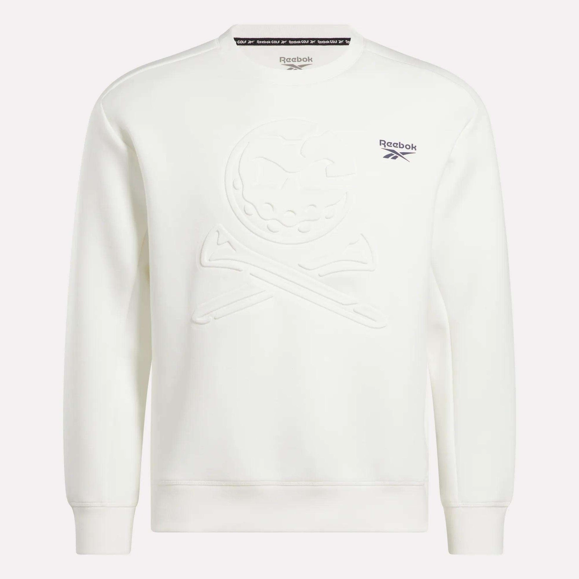 The Reebok Men's Scuba Knit Crew Sweatshirt is a white golf top with a subtle embossed skull and crossbones on the front, moisture-wicking fabric, and blue Reebok logo and text on the left chest.