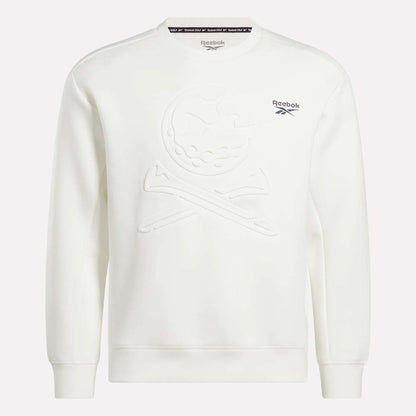 The Reebok Men's Scuba Knit Crew Sweatshirt is a white golf top with a subtle embossed skull and crossbones on the front, moisture-wicking fabric, and blue Reebok logo and text on the left chest.