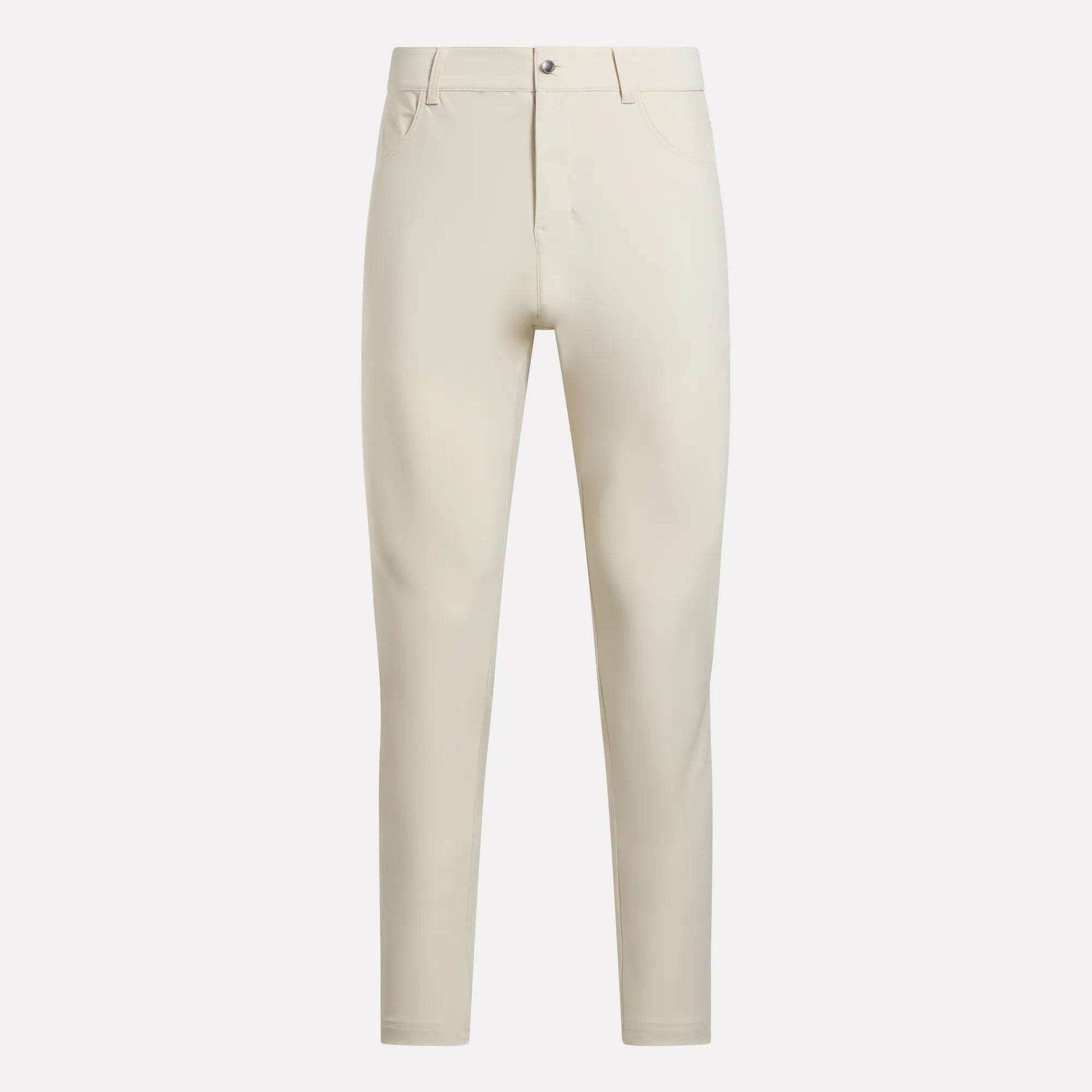 The Reebok Men's Favorite 5-Pocket Relaxed Fit Golf Pants, in light beige wrinkle-resistant fabric with belt loops, button closure, and front pockets, are shown against a plain white background.