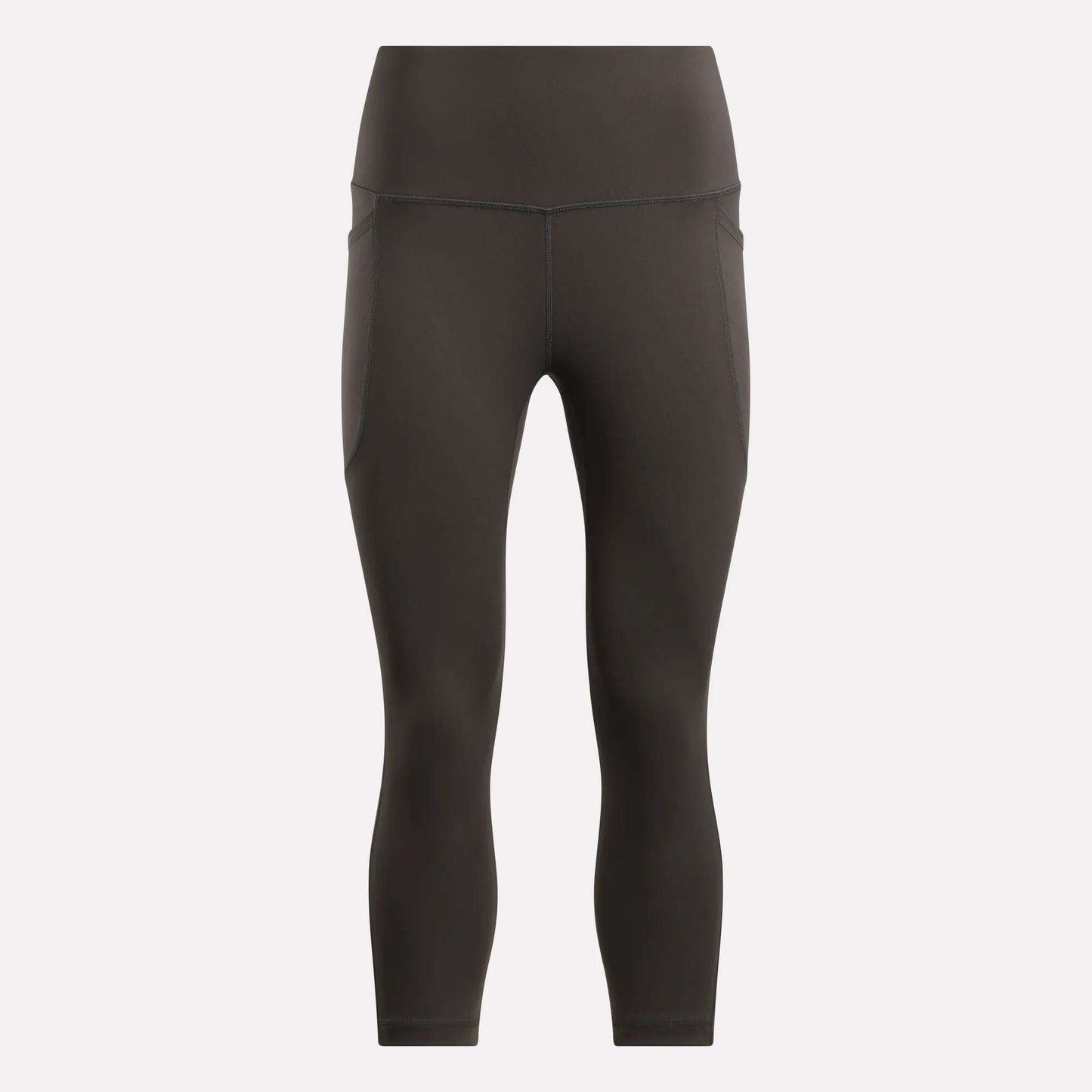 Reebok Women's Capri Leggings in black, shown on a plain light background. These fitted, high-waisted leggings offer a smooth finish, subtle seam details, and ankle-length style—ideal for any fitness routine.