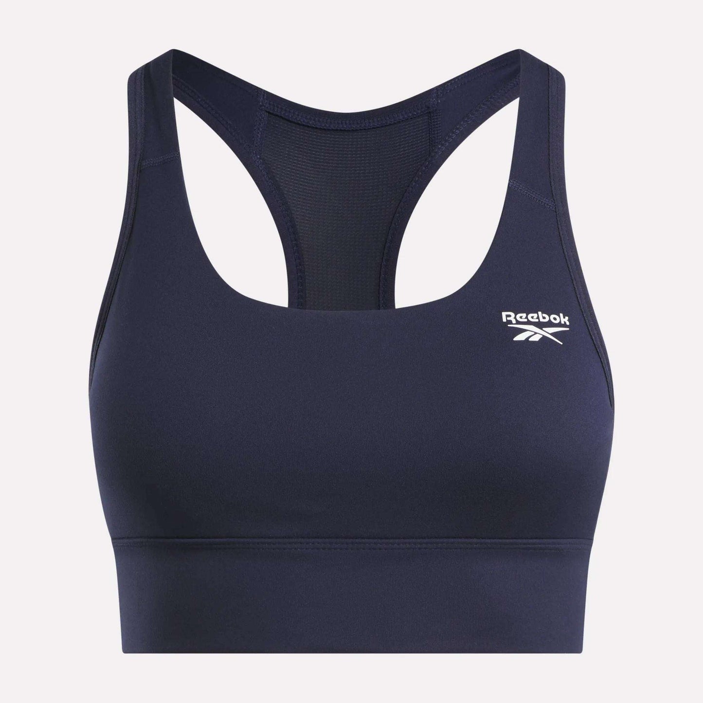 The Reebok Women's Rush Medium-Impact Sports Bra features a navy blue racerback design, mesh back panel, and a white logo on the left chest—perfect for medium-impact workouts.