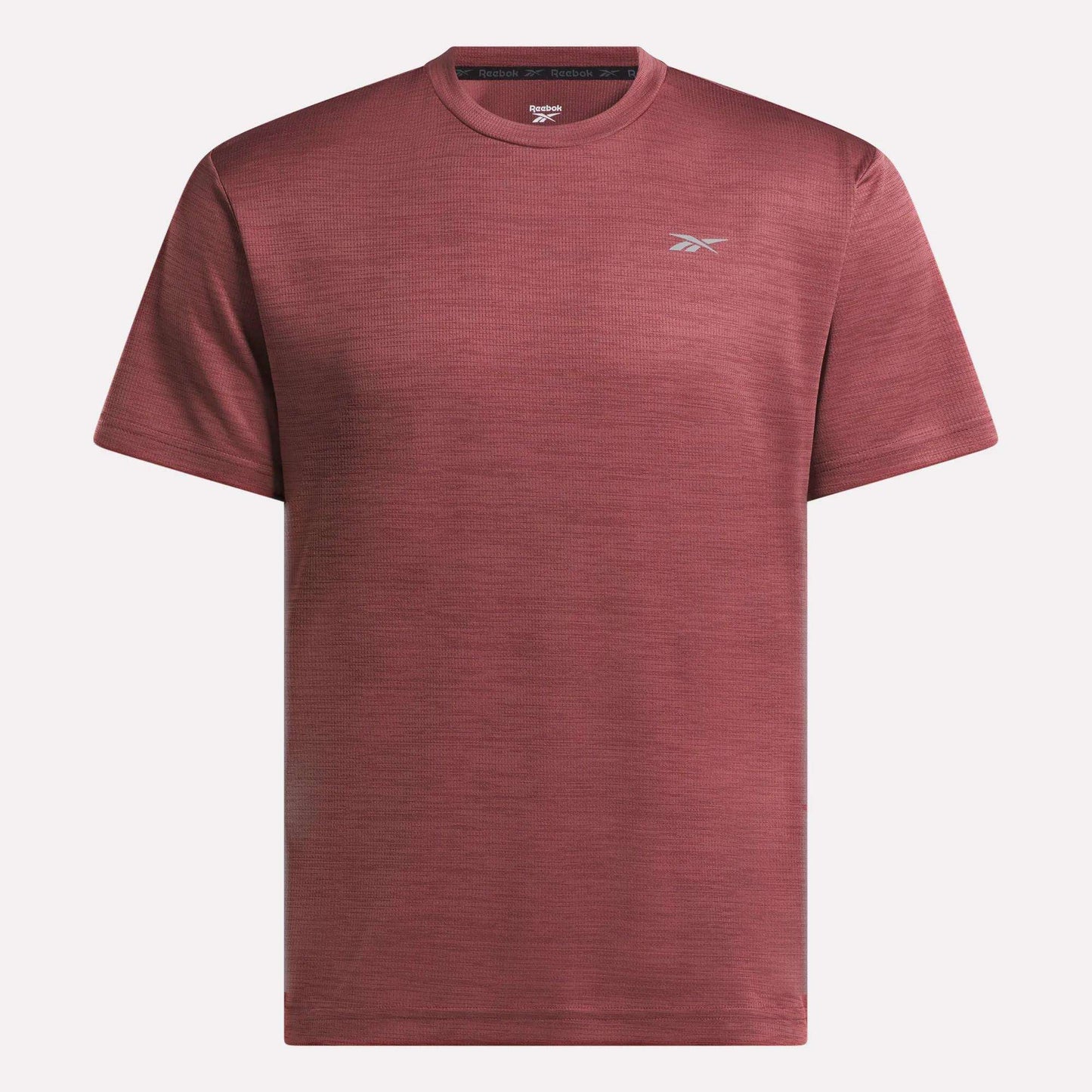 The Reebok Men's Director Short Sleeve Top is a plain maroon training t-shirt with short sleeves and a small white logo on the left chest, shown on a white background. Its stretchy fabric makes it ideal for any workout.