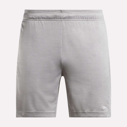 The Reebok Men's Inclination Shorts feature an elastic waistband and a white logo on the lower left leg, shown from the back in light gray—a versatile choice for men's workouts.