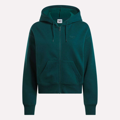 The Reebok Women's Cropped Full-Zip Hoodie in dark green features a cozy knit fabric, hood, front zipper, roomy pockets, and a small embroidered logo on the left chest, shown against a plain white background.