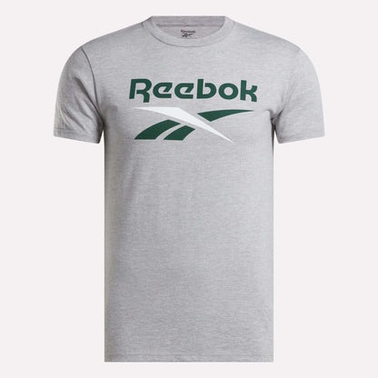 The Reebok Men's Stacked Vector Graphic T-Shirt is heather gray with a bold green and white logo on the chest. Made from 100% cotton, it features a classic crew neck and a casual, timeless design.