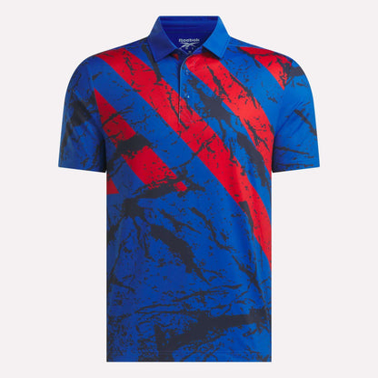 A blue Reebok Men's Tournament Polo Shirt featuring a red and black abstract diagonal pattern across the front and a classic collar, crafted from performance jersey fabric for comfort on and off the course.