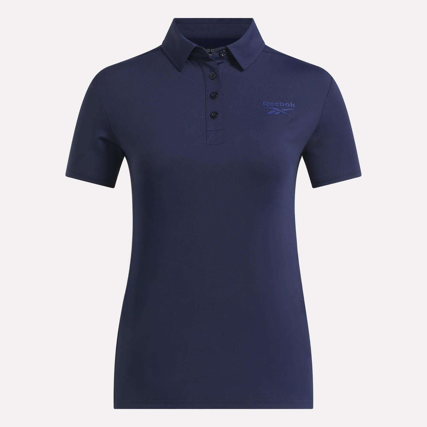 The Reebok Women's Solid Core Polo Shirt in navy blue features a collared design with three buttons and a subtle Reebok logo on the left chest. Crafted from comfortable performance jersey fabric, this fitted polo offers short sleeves—making it an excellent choice for both casual outings and golf days on the green.