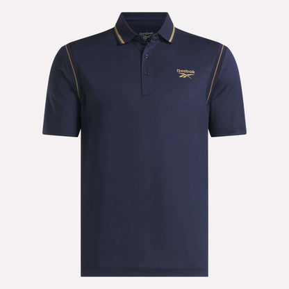 The Men's Varsity Polo Shirt by Reebok is a navy blue golf polo for men, featuring short sleeves, a three-button placket, yellow piping on the shoulders, and a yellow Reebok logo on the left chest; this UPF-rated polo combines style with sun protection for active days.