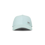 The Reebok Badge Cap in light blue features a curved brim, small embroidered front-left logo, and a Speedwick sweatband for moisture-wicking comfort. Shown facing forward on a white background.