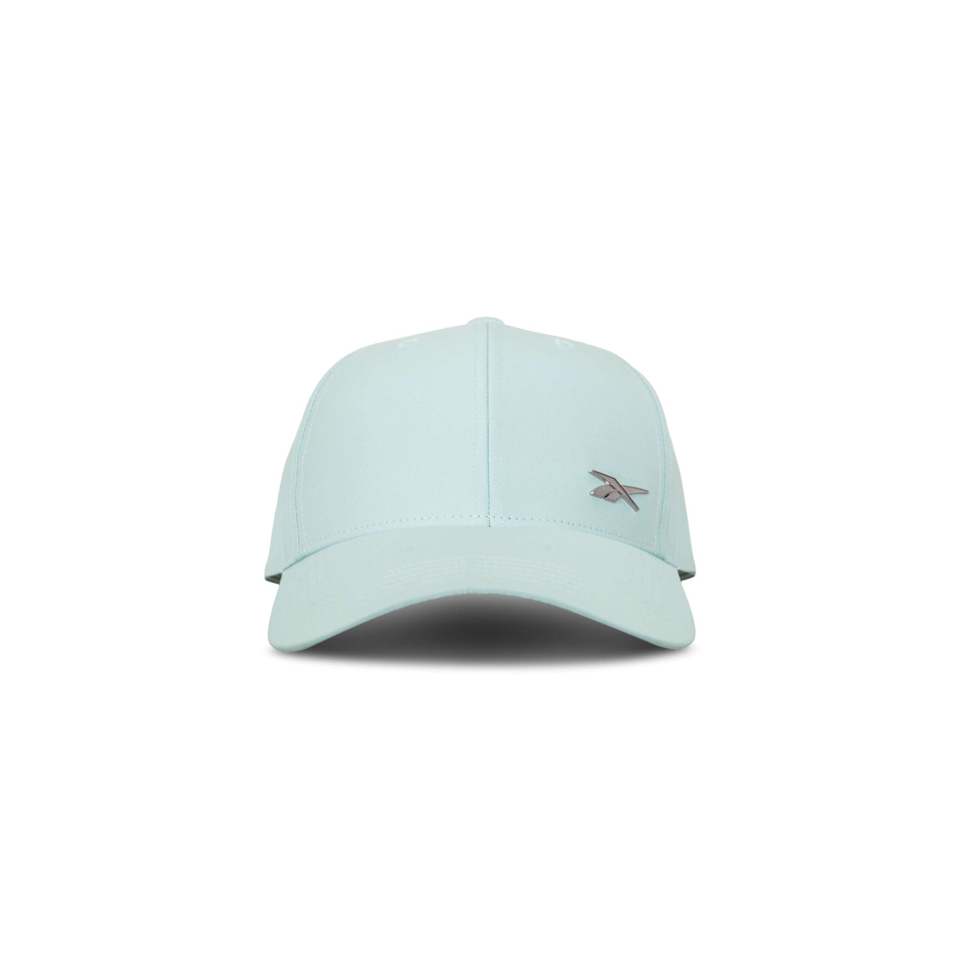 The Reebok Badge Cap in light blue features a curved brim, small embroidered front-left logo, and a Speedwick sweatband for moisture-wicking comfort. Shown facing forward on a white background.