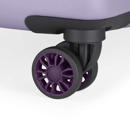 Close-up of the durable spinner wheels on the corner of a light purple Reebok Captain 2 Piece Luggage Set suitcase, shown against a plain white background.