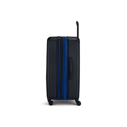 The Reebok Action Duo 2 Piece Luggage Set is shown upright against a white background, featuring a black lightweight design with vertical ridges, blue zipper accents, an extended handle, and four spinner wheels.