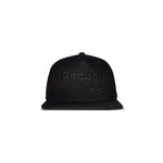 The Reebok Double Vision Cap is a black snapback street style hat with a flat brim and black embroidered Reebok logo and text on the front, displayed against a plain white background.