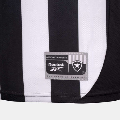 Close-up of the Botafogo Men's Home Jersey by Reebok: black and white stripes, gray patch with Reebok logo, shield emblem, and text reading "The Official Garment" and "Designed in the BFR.