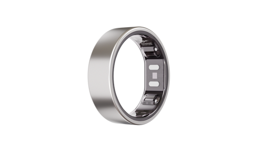 The Reebok Smart Ring, a sleek silver wearable by Reebok with visible inner-band sensors, is displayed upright against a plain white background.