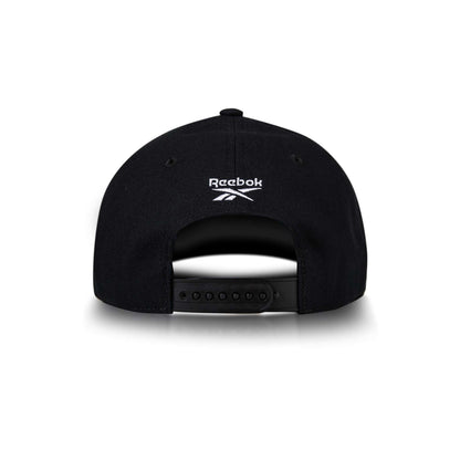 A black Reebok Vector Baseball Cap viewed from the back, featuring an adjustable snapback closure and a white embroidered Reebok logo above the opening.