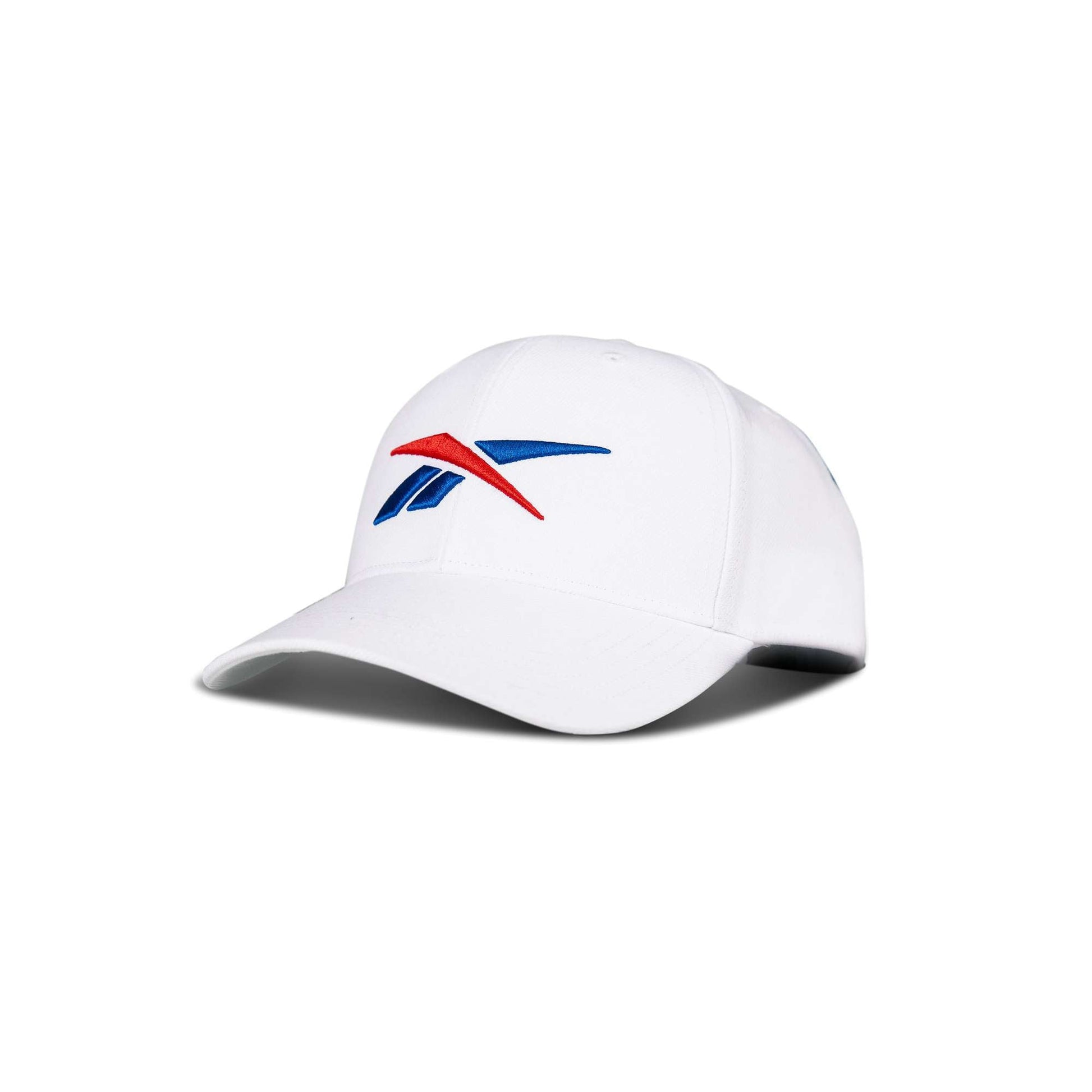 The Reebok Vector Baseball Cap is a white hat with the blue and red Reebok logo on the front, shown against a plain white background.