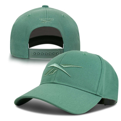 The Reebok Vector Baseball Cap is shown front and back. It features a curved brim with an embroidered Reebok logo, plus an adjustable snapback and the Reebok name above the rear opening.