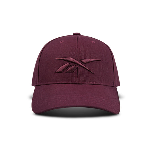 The Vector Baseball Cap by Reebok is maroon with a matching embroidered logo on the front, displayed against a white background.