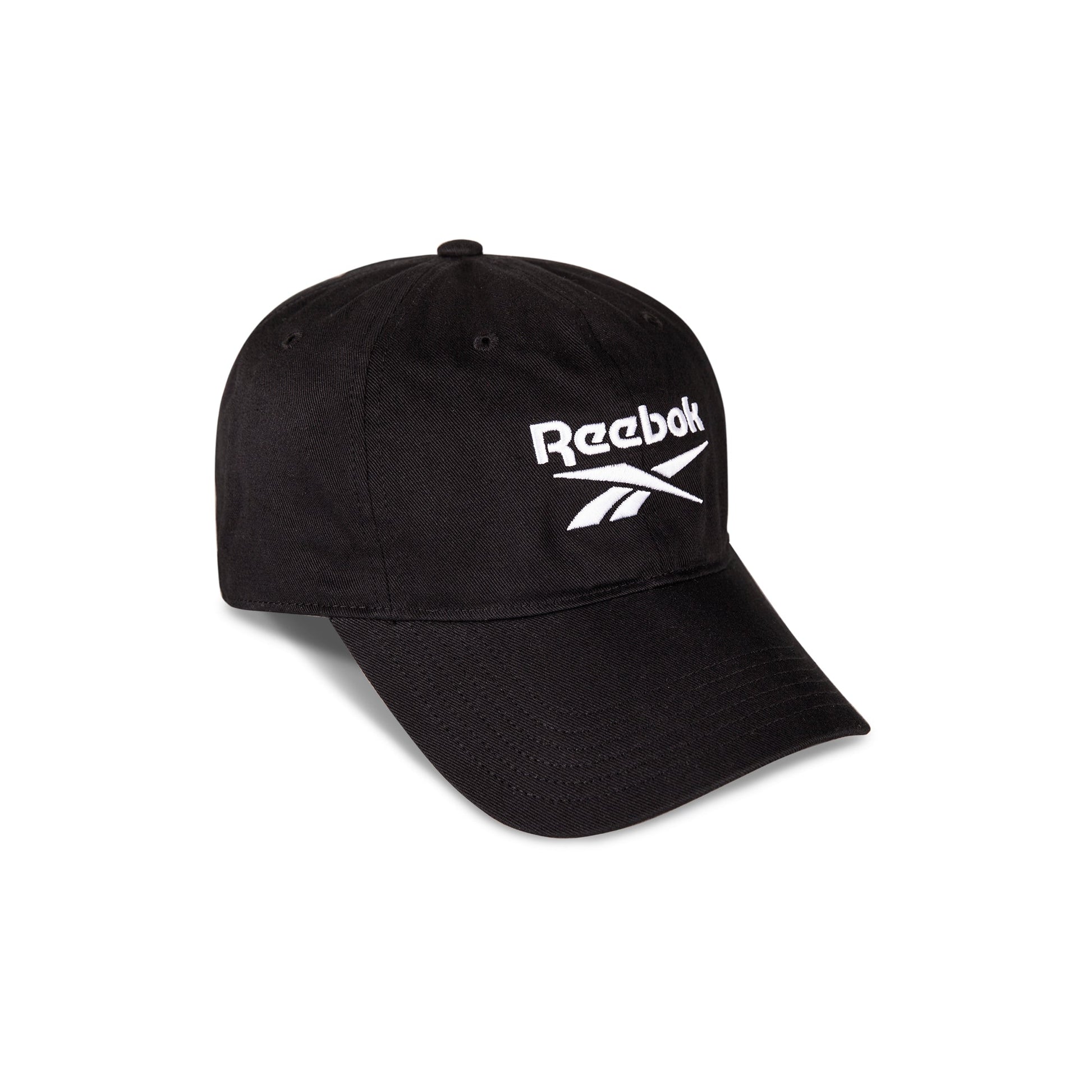 The Reebok Logo Cap is crafted from black cotton twill, featuring a curved brim, bold white embroidered logo and text on the front, and an adjustable buckle closure. Photographed against a white background.