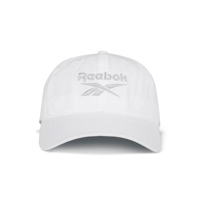 The Reebok Logo Cap is a classic white cotton twill cap with a curved brim, light gray Reebok logo embroidery on the front, and an adjustable buckle closure for a perfect fit.