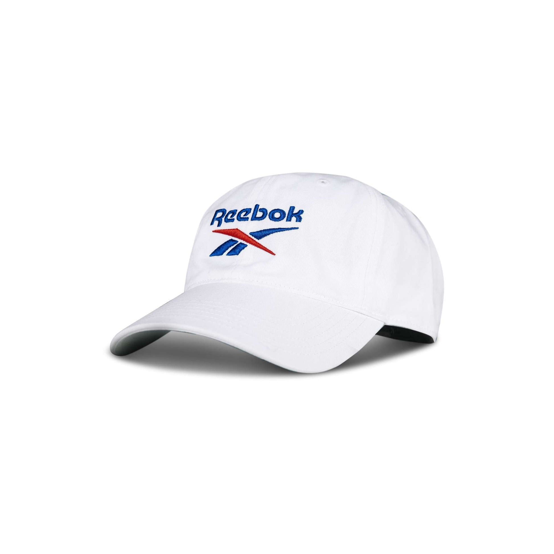 The Reebok Logo Cap is a white baseball cap with a curved brim and the blue and red Reebok logo embroidered on the front, displayed against a plain white background.