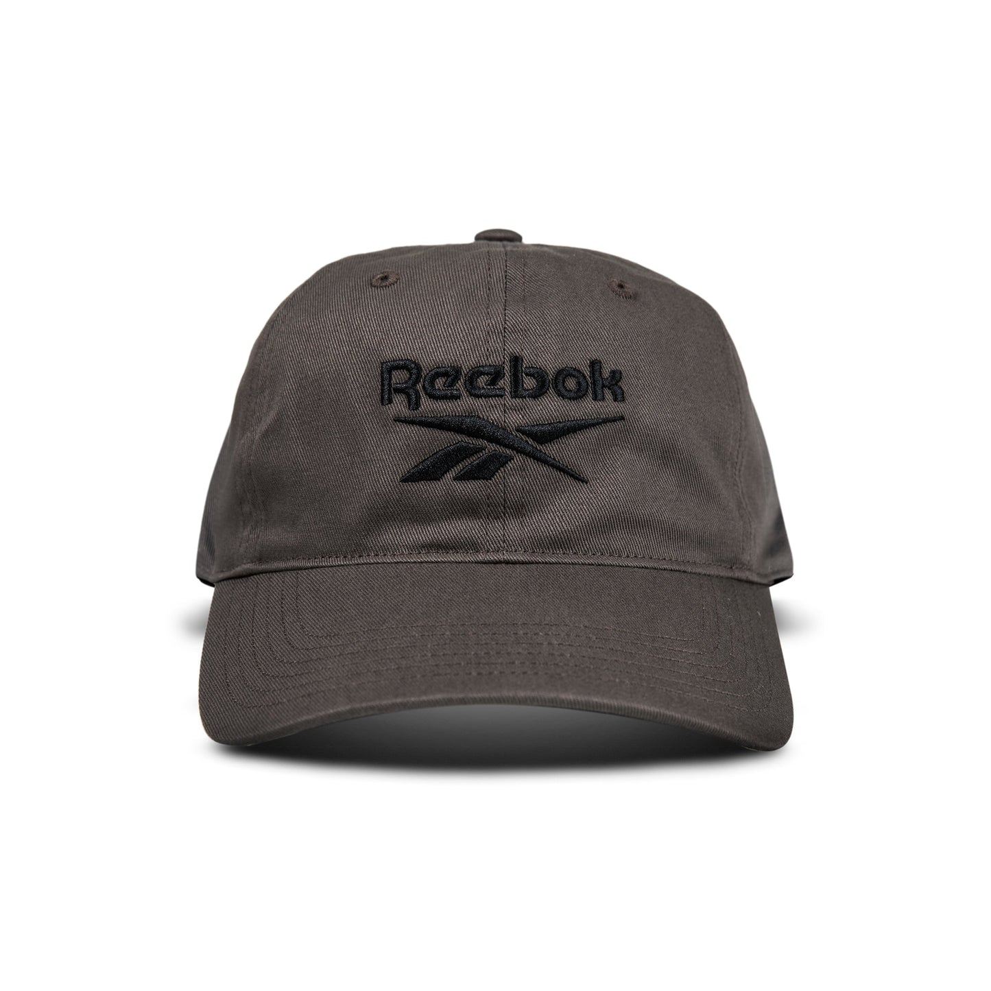 A dark gray Reebok Logo Cap with a black embroidered logo and text on the front is displayed from the front against a white background.