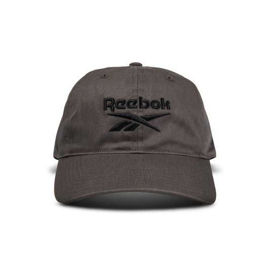 A dark gray Reebok Logo Cap with a black embroidered logo and text on the front is displayed from the front against a white background.
