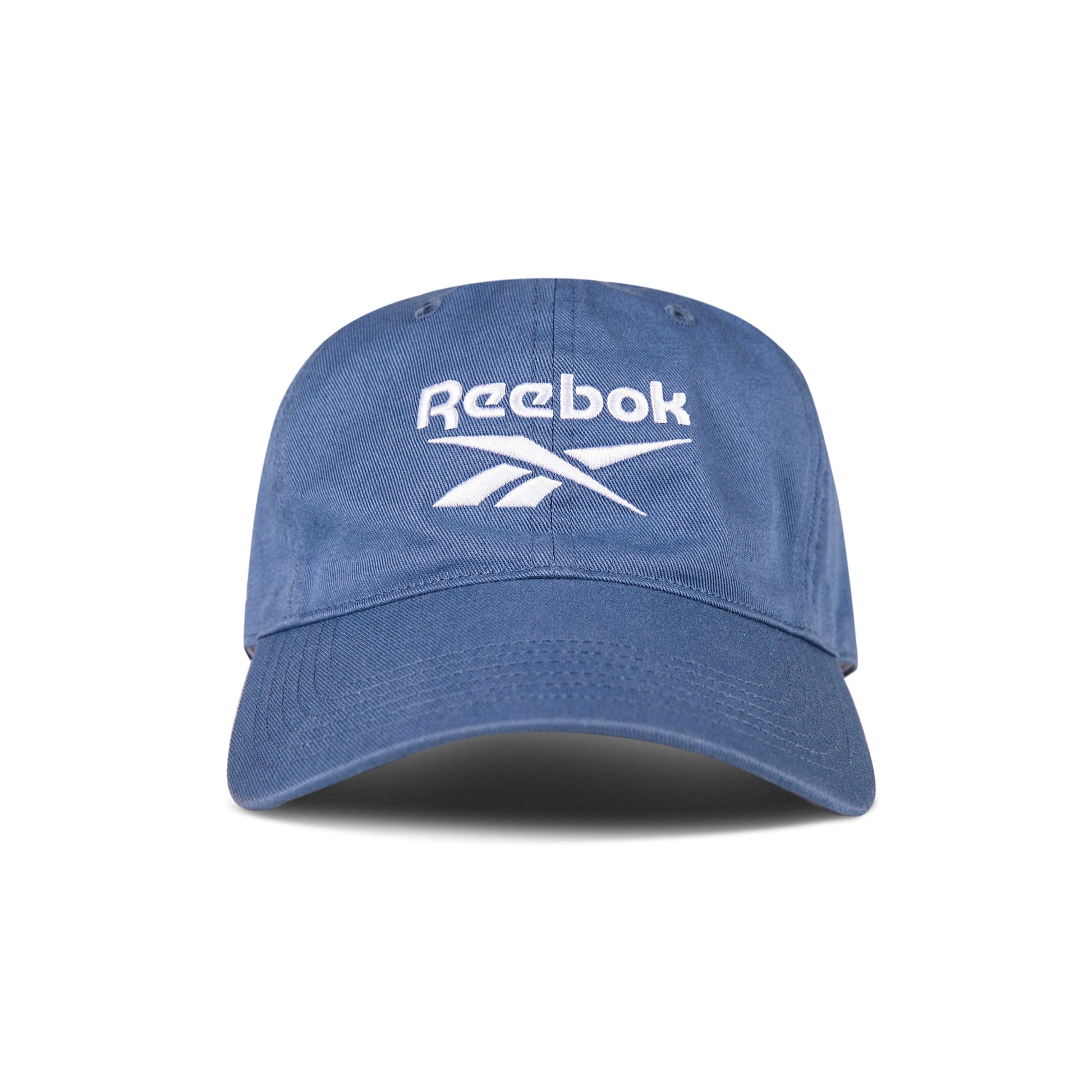 The Reebok Logo Cap features a curved brim and front white logo embroidery. Made from cotton twill with an adjustable buckle for comfort, this cap is shown against a white background.
