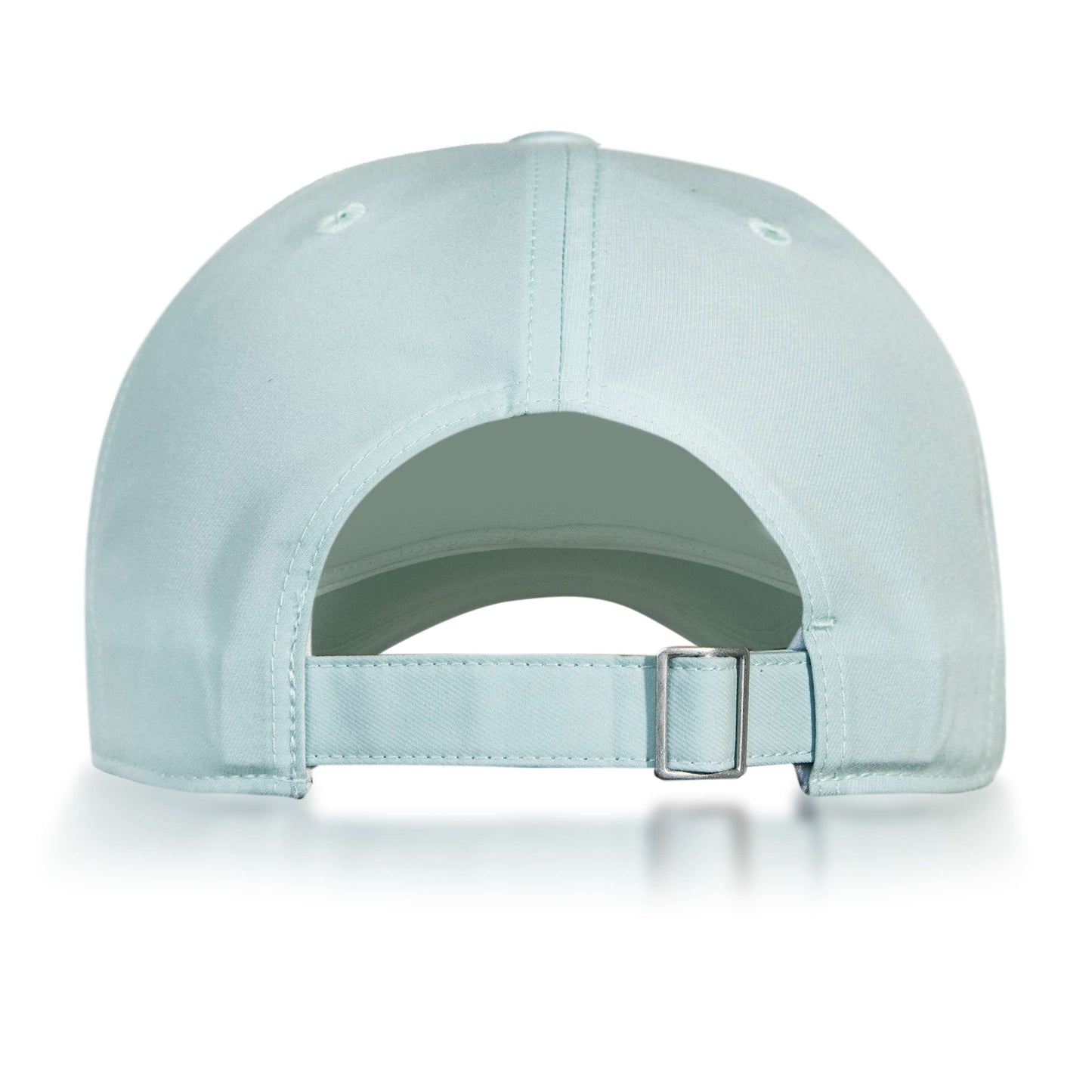 The Reebok Badge Cap in light blue is shown from the back, with an adjustable metal-buckle strap, stitched top-panel eyelets, and a moisture-wicking Speedwick sweatband for comfort.