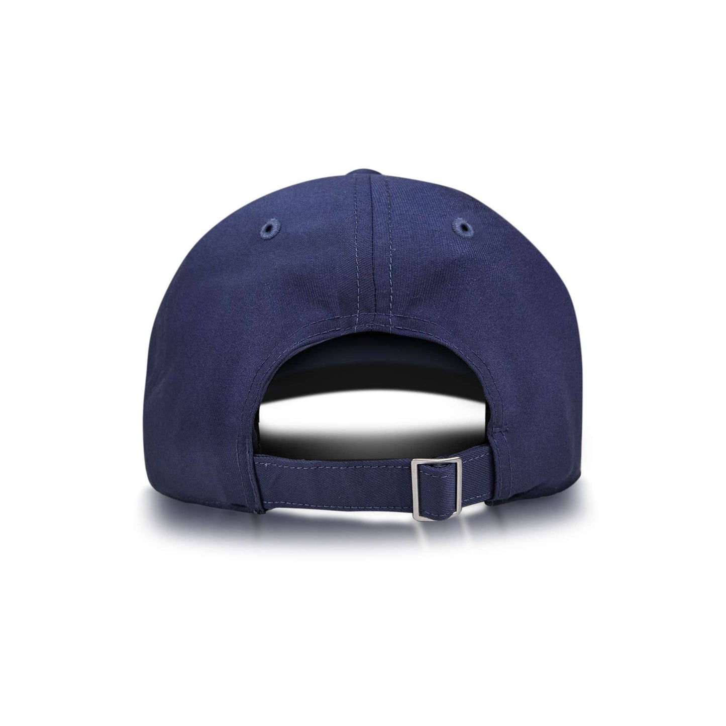 The Reebok Badge Cap is shown from the back in navy blue, with an adjustable strap and metal buckle, plus two ventilation eyelets on each side near the top. The background is plain white.
