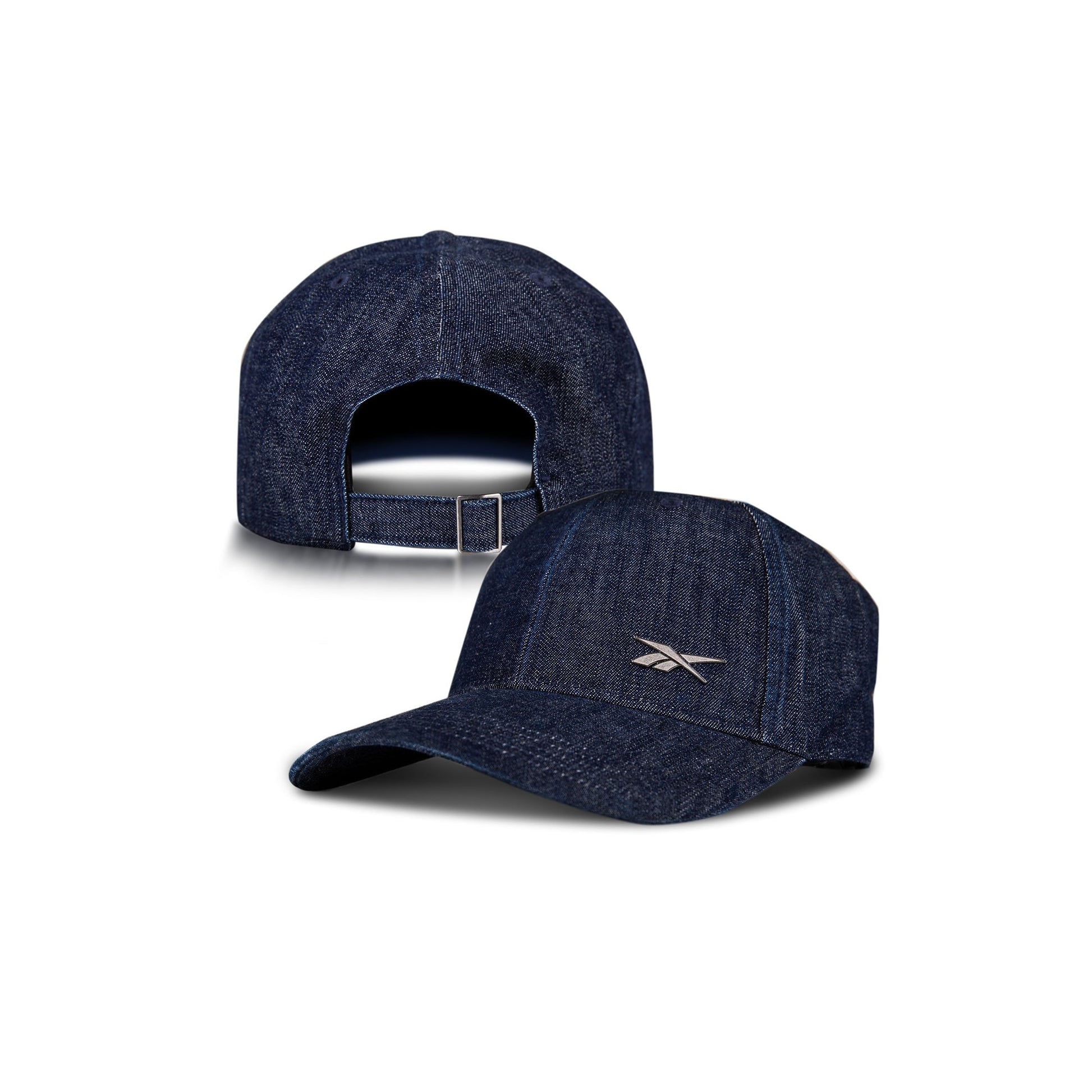 Two Denim Badge Caps by Reebok are shown on a white background: one displays the front with a small white Reebok logo, the other shows the back and adjustable strap. Both include a Speedwick sweatband for comfort.