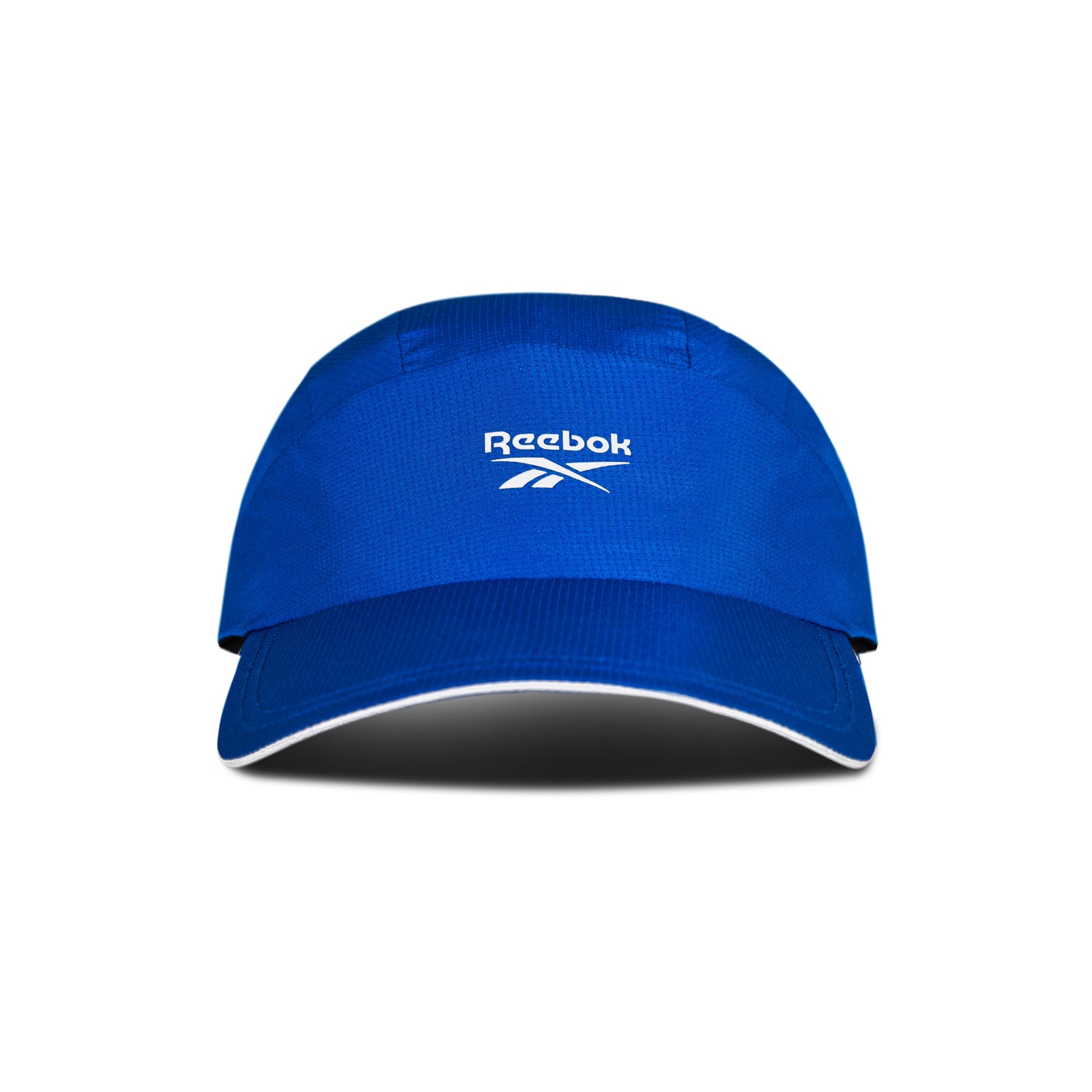 The Reebok Running Cap is a blue sports visor with a curved brim and white Reebok logo on the front, shown on a white background with a shadow. This lightweight cap offers comfort and moisture-wicking performance for runners.
