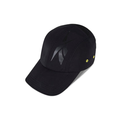 The Reebok Technical Running Cap With Drawcord, made from recycled materials, features a shiny black abstract front logo and two yellow side eyelets, displayed on a white background.