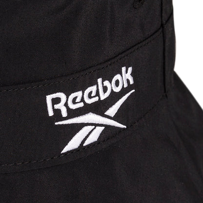 Close-up of a black Reebok Bucket Hat with the white embroidered Reebok logo and text.