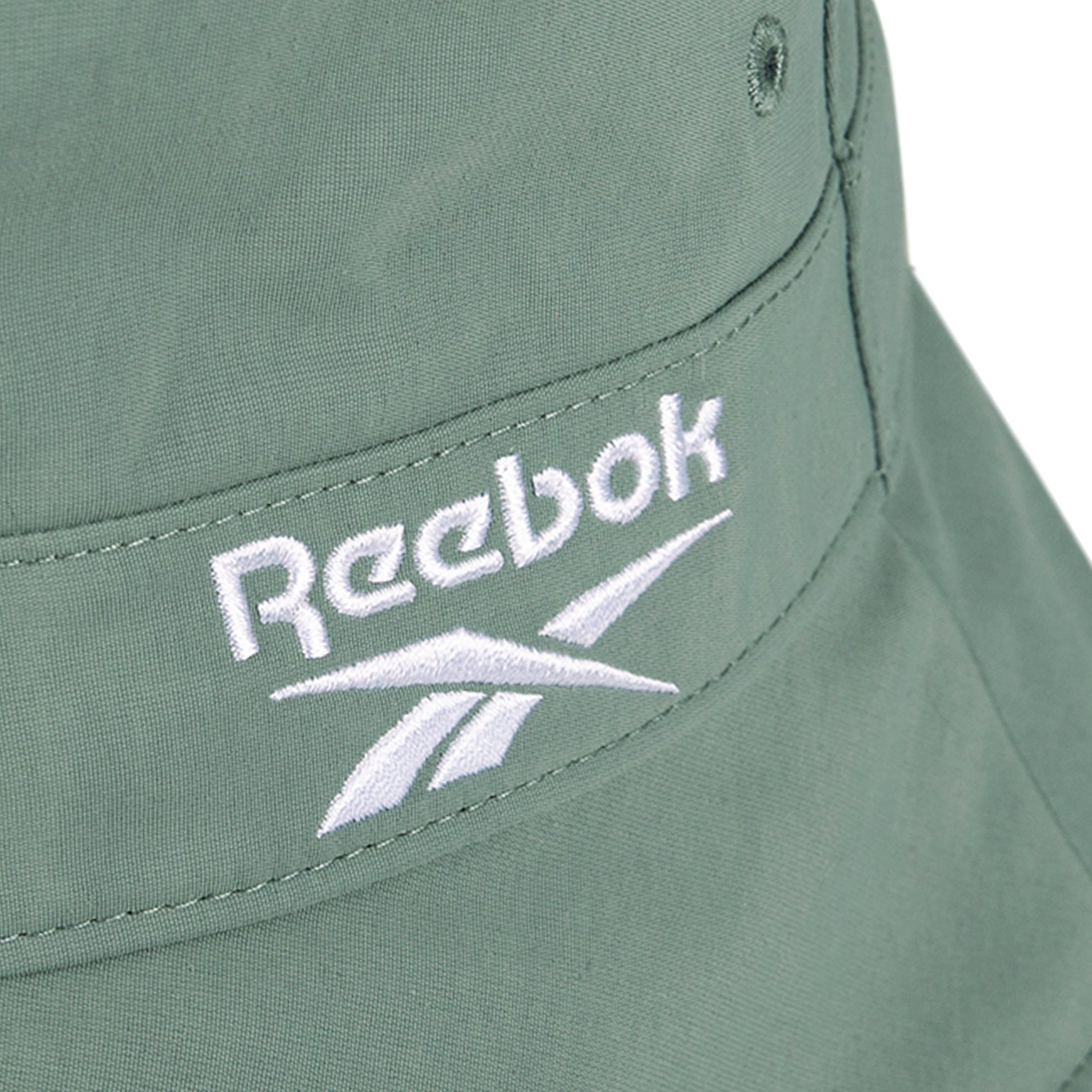 Close-up of a sage green Reebok Bucket Hat, made from recycled nylon and finished with a white embroidered Reebok logo.
