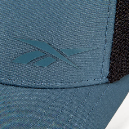 Close-up of the Reebok Athletic Cap in blue, highlighting the front left logo, moisture-wicking sweatband, visible stitching, and black mesh side section.