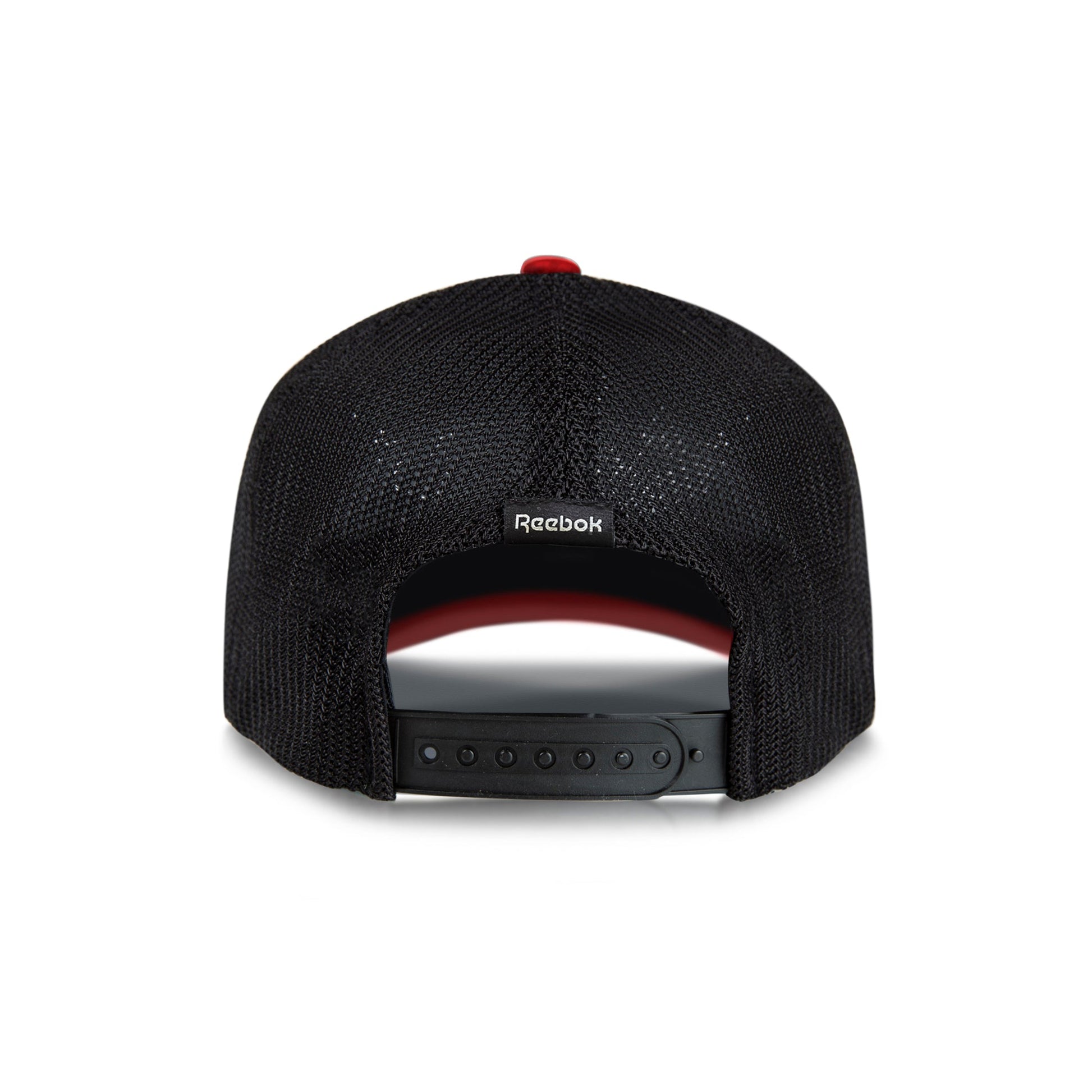 The Reebok Athlete Cap is a black mesh baseball cap seen from the back, featuring an adjustable snapback closure and a small Reebok logo tag above the opening.