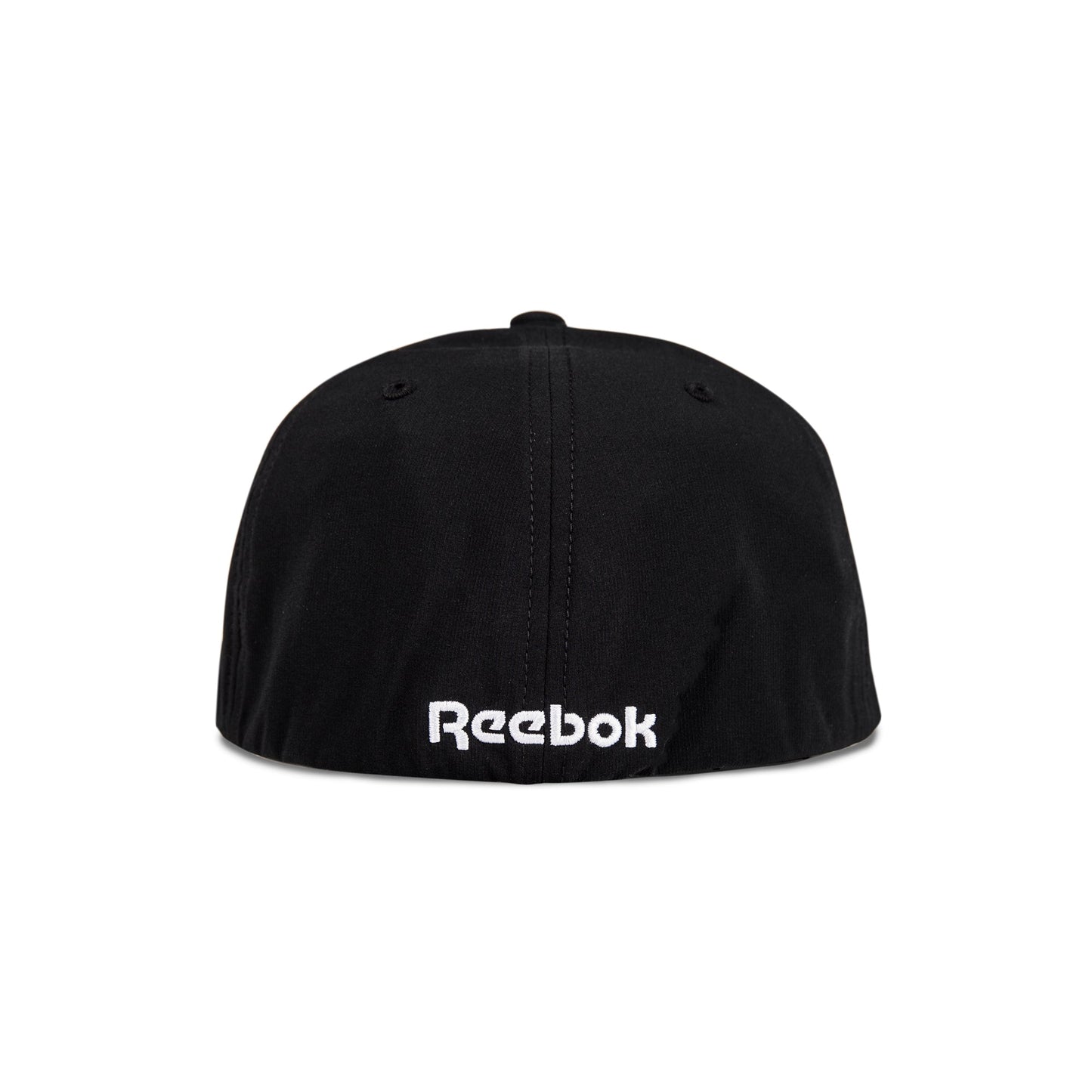 The image shows the back view of the Reebok Range Cap, a black cap featuring the white embroidered Reebok logo near the bottom edge.